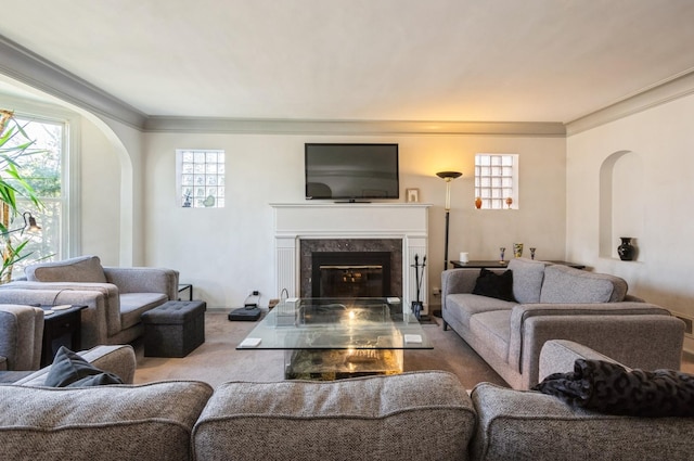 6504 N Artesian Ave, Chicago, IL 60645 - living room featuring arched walkways, a high end fireplace, crown molding, and carpet flooring