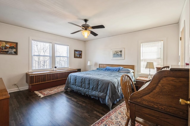 6504 N Artesian Ave, Chicago, IL 60645 - bedroom featuring multiple windows, wood finished floors, a ceiling fan, and baseboards
