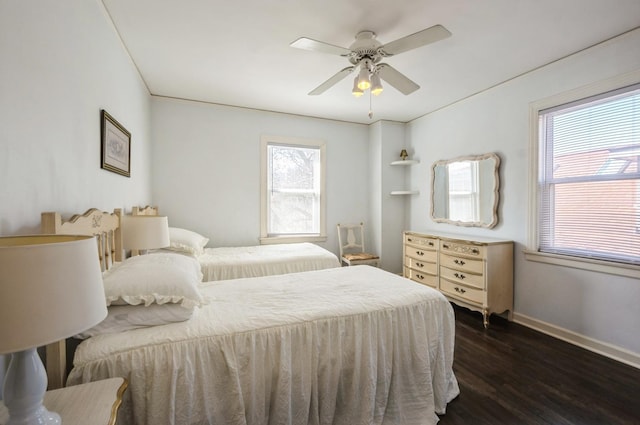 6504 N Artesian Ave, Chicago, IL 60645 - bedroom featuring dark wood-style floors, baseboards, and a ceiling fan