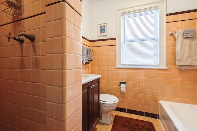 6504 N Artesian Ave, Chicago, IL 60645 - full bath featuring tile walls, toilet, tile patterned floors, a tub, and a wainscoted wall