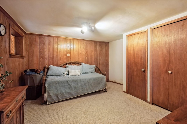 6504 N Artesian Ave, Chicago, IL 60645 - bedroom with light colored carpet, multiple closets, and wooden walls