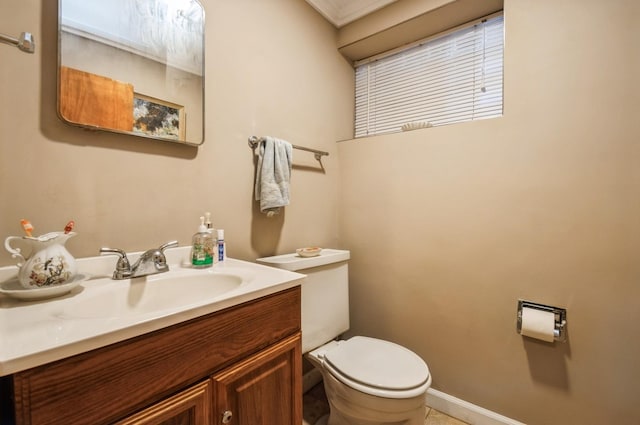 6504 N Artesian Ave, Chicago, IL 60645 - bathroom featuring toilet, vanity, and baseboards