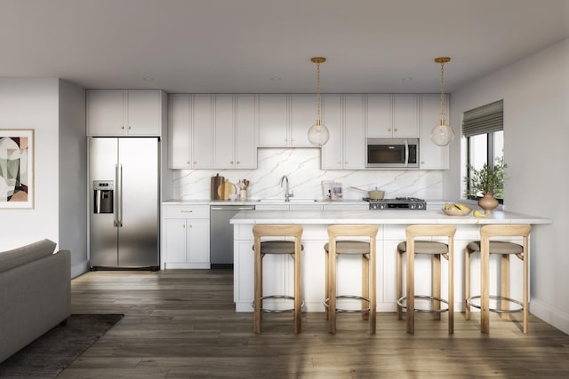 kitchen with appliances with stainless steel finishes, light countertops, tasteful backsplash, and a sink