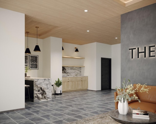 living area with wood ceiling, recessed lighting, and a high ceiling