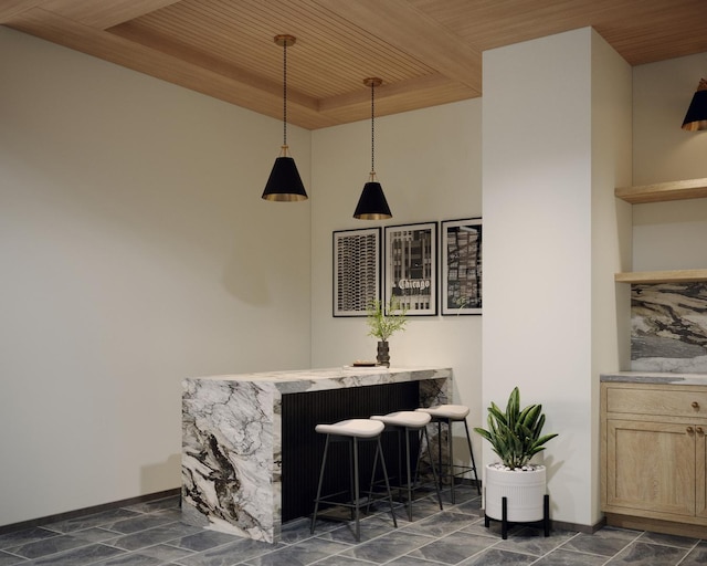 indoor dry bar with wood ceiling and decorative light fixtures