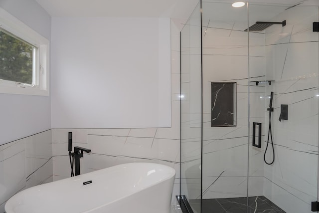 13636 Savanna Dr, Plainfield, IL 60544 - bathroom featuring a marble finish shower, tile walls, and a freestanding tub