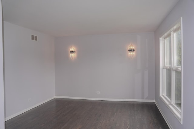 13636 Savanna Dr, Plainfield, IL 60544 - spare room with dark wood-style flooring and baseboards