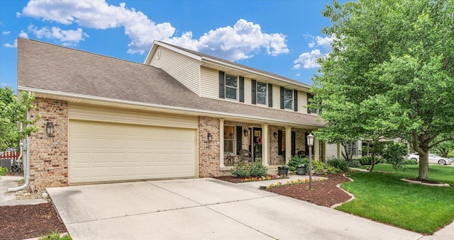 3408 Mill Creek Ct, Champaign, IL 61822 - traditional-style home with brick siding, covered porch, driveway, an attached garage, and a front yard