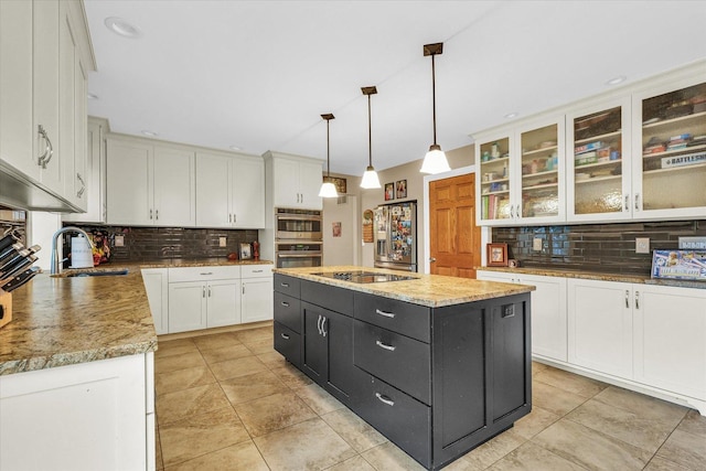 3408 Mill Creek Ct, Champaign, IL 61822 - kitchen featuring a sink, white cabinets, backsplash, and dark cabinetry