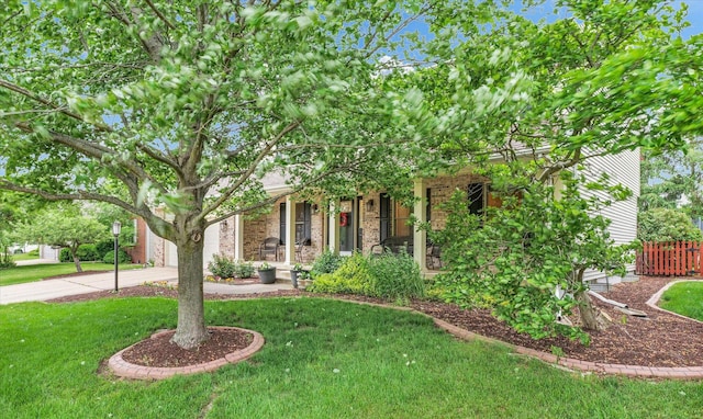 3408 Mill Creek Ct, Champaign, IL 61822 - view of property hidden behind natural elements featuring driveway, brick siding, and a garage