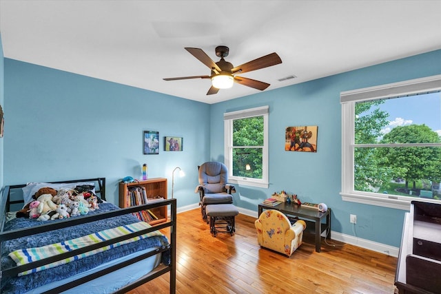 3408 Mill Creek Ct, Champaign, IL 61822 - bedroom with light wood-type flooring, baseboards, and a ceiling fan