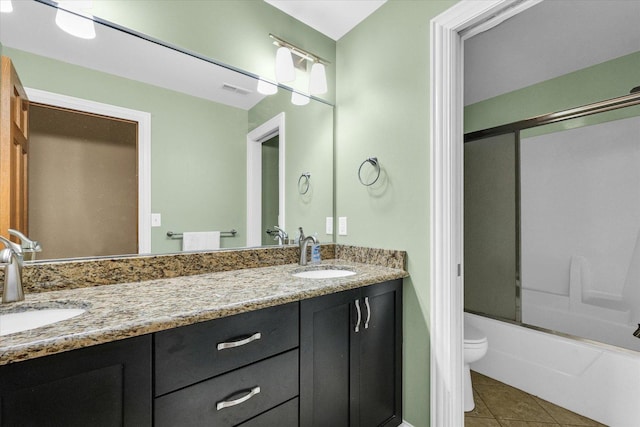 3408 Mill Creek Ct, Champaign, IL 61822 - full bathroom featuring double vanity, toilet, tile patterned flooring, and enclosed tub / shower combo
