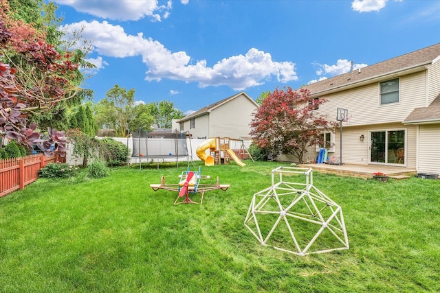 3408 Mill Creek Ct, Champaign, IL 61822 - view of yard featuring a trampoline and a playground