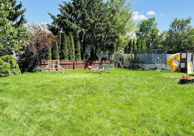 3408 Mill Creek Ct, Champaign, IL 61822 - view of yard with a trampoline