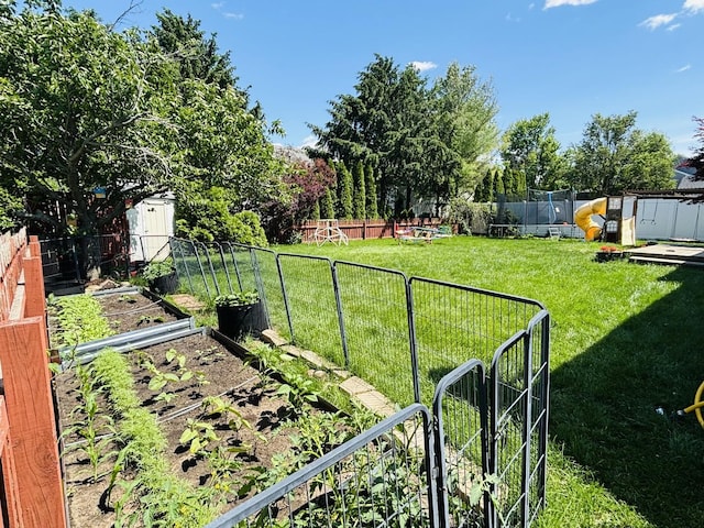 3408 Mill Creek Ct, Champaign, IL 61822 - view of yard featuring a garden and a storage unit