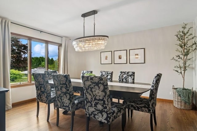 22902 W Lochanora Dr, Hawthorn Woods, IL 60047 - dining room featuring a chandelier, baseboards, and wood finished floors