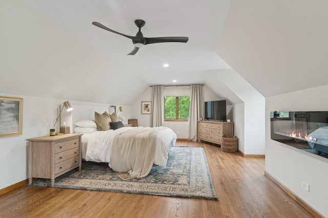 22902 W Lochanora Dr, Hawthorn Woods, IL 60047 - bedroom with vaulted ceiling, wood finished floors, baseboards, and a ceiling fan