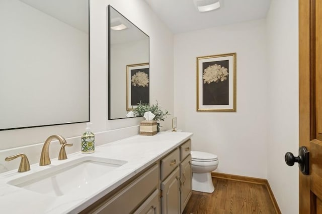 22902 W Lochanora Dr, Hawthorn Woods, IL 60047 - bathroom featuring toilet, vanity, wood finished floors, and baseboards