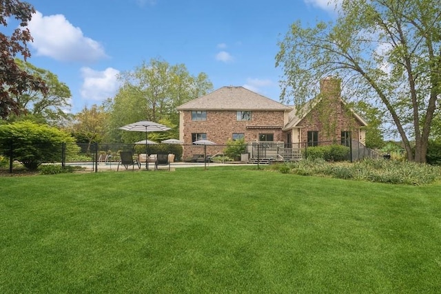 22902 W Lochanora Dr, Hawthorn Woods, IL 60047 - rear view of house with a chimney and brick siding