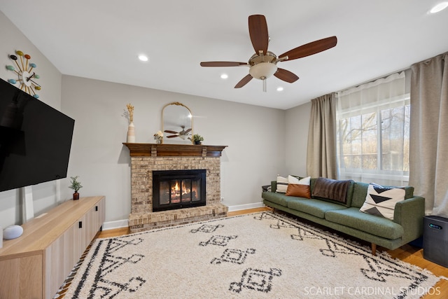 647 Glacier Trl, Roselle, IL 60172 - living area featuring light wood finished floors, ceiling fan, a brick fireplace, recessed lighting, and baseboards