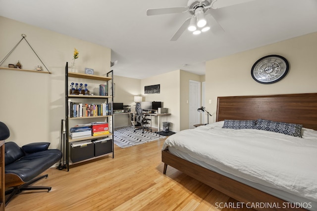 647 Glacier Trl, Roselle, IL 60172 - bedroom with light wood finished floors, a desk, and a ceiling fan
