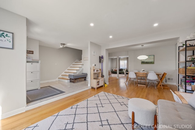 647 Glacier Trl, Roselle, IL 60172 - living room with stairs, wood finished floors, recessed lighting, and baseboards