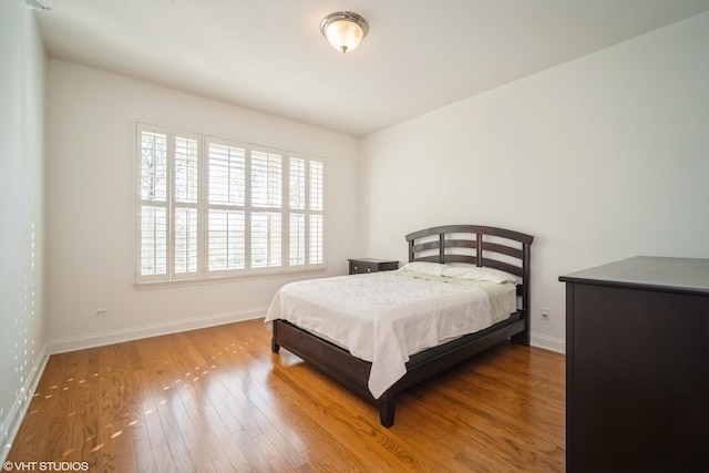 2700 Summit Dr Unit 307, Glenview, IL 60025 - bedroom with baseboards and wood finished floors