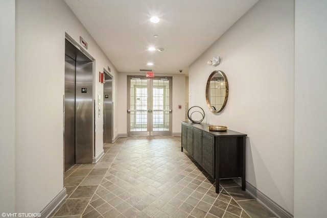 2700 Summit Dr Unit 307, Glenview, IL 60025 - hall with elevator, baseboards, and recessed lighting