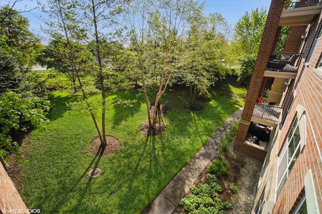 2700 Summit Dr Unit 307, Glenview, IL 60025 - view of grassy yard featuring a balcony