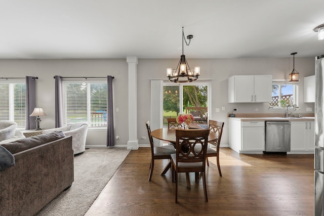 1876 Ione Ln, Aurora, IL 60503 - dining area with wood finished floors, a chandelier, and baseboards