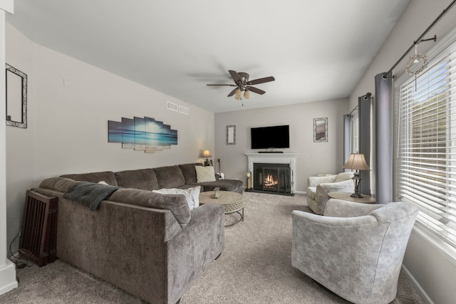 1876 Ione Ln, Aurora, IL 60503 - carpeted living area featuring a ceiling fan, a lit fireplace, and baseboards