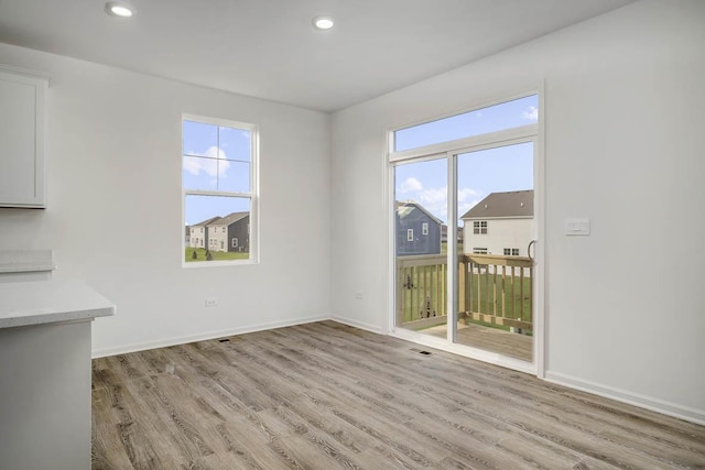 15102 W Cambridge Ln, Manhattan, IL 60442 - unfurnished dining area with light wood-style floors, healthy amount of natural light, baseboards, and recessed lighting