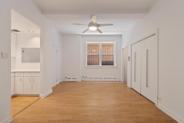 431 W Oakdale Ave Unit 1C, Chicago, IL 60657 - corridor with a baseboard radiator, baseboard heating, light wood finished floors, and baseboards