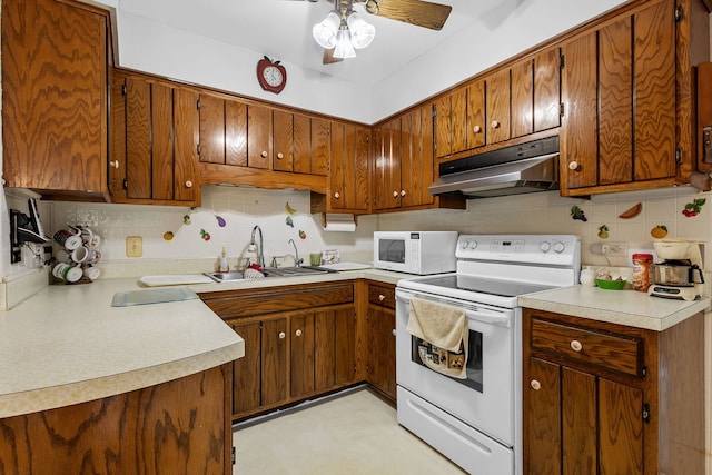 2841 E Pine Dr, Crete, IL 60417 - kitchen featuring under cabinet range hood, white appliances, and brown cabinets