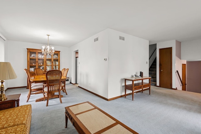 2841 E Pine Dr, Crete, IL 60417 - dining area featuring light colored carpet, stairs, and a chandelier