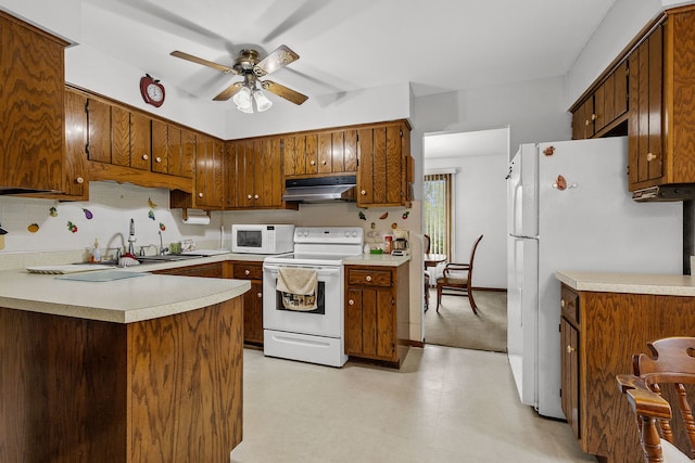 2841 E Pine Dr, Crete, IL 60417 - kitchen featuring white appliances, under cabinet range hood, a ceiling fan, light countertops, and tasteful backsplash