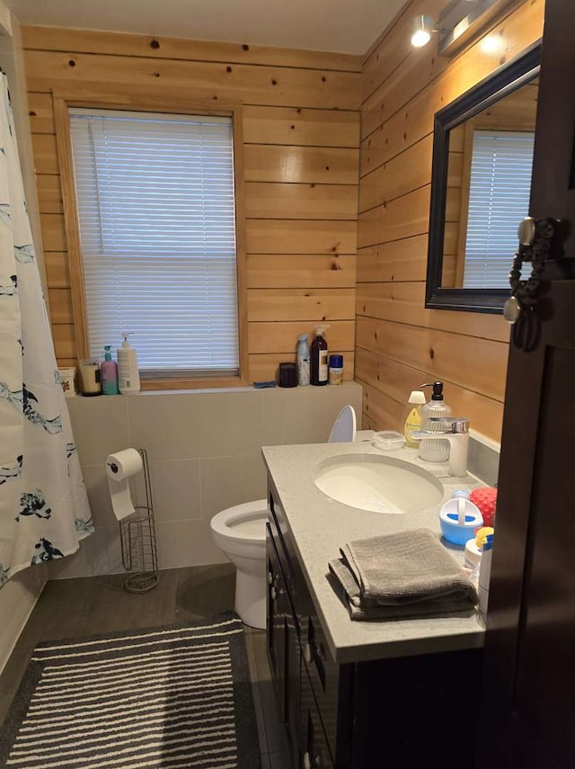 4044 Wesley Ter, Schiller Park, IL 60176 - bathroom with vanity, toilet, wooden walls, and curtained shower