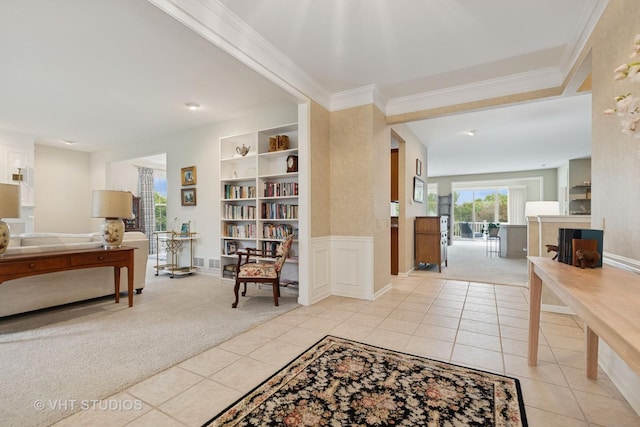 12433 Foxtail Ln, Huntley, IL 60142 - entryway featuring light tile patterned flooring, crown molding, light colored carpet, and baseboards