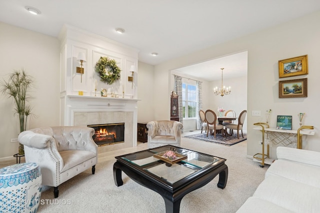 12433 Foxtail Ln, Huntley, IL 60142 - living area featuring a tiled fireplace, carpet, a chandelier, and baseboards