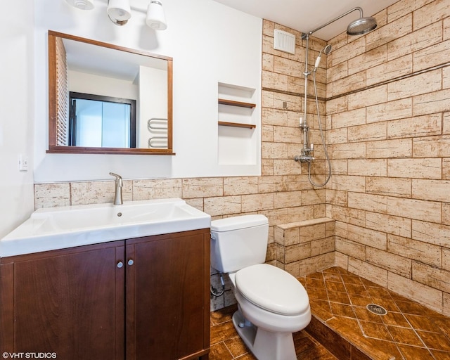 5455 N Sheridan Rd Unit 901, Chicago, IL 60640 - full bath with tiled shower, vanity, tile walls, and toilet