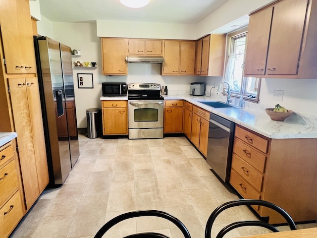 270 W Margaret Fuller Rd, Oregon, IL 61061 - kitchen with stainless steel appliances, a sink, under cabinet range hood, and light countertops