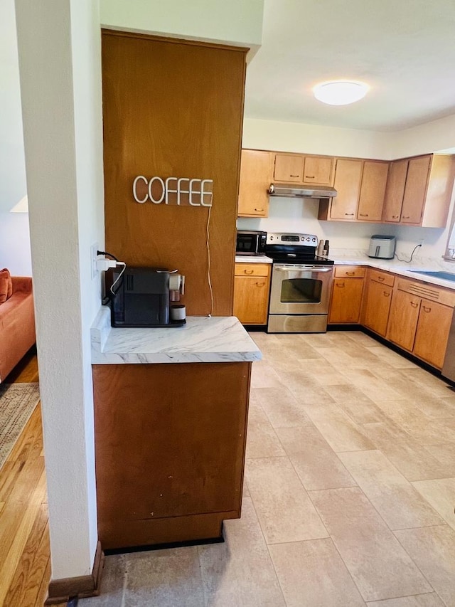 270 W Margaret Fuller Rd, Oregon, IL 61061 - kitchen with electric stove, a sink, and under cabinet range hood