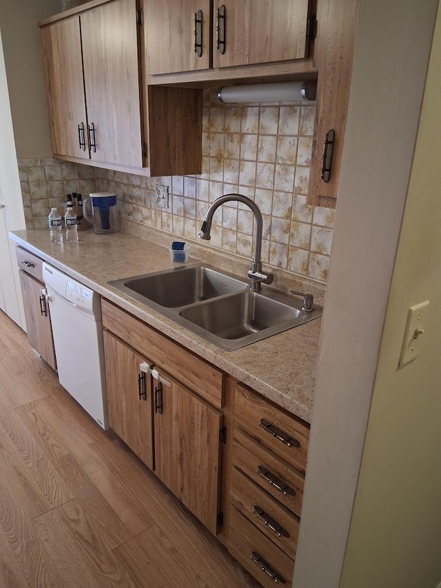 1702 Mill St Unit 502, Des Plaines, IL 60016 - kitchen with dishwasher, a sink, light countertops, and decorative backsplash