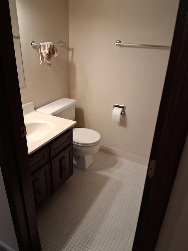 1702 Mill St Unit 502, Des Plaines, IL 60016 - half bathroom featuring toilet, vanity, and tile patterned floors