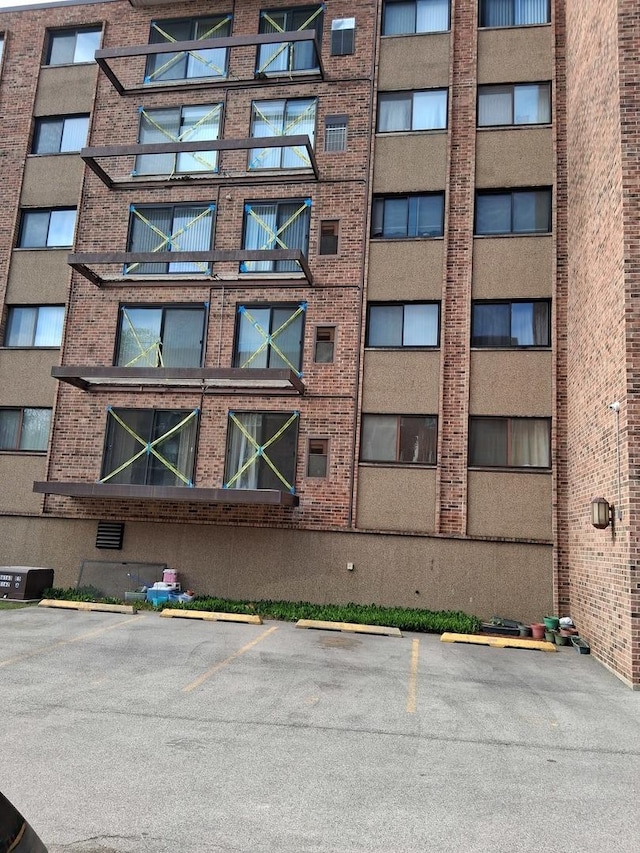 1702 Mill St Unit 502, Des Plaines, IL 60016 - view of apartment building / complex with uncovered parking