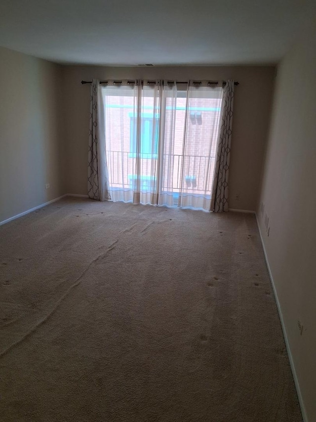 1702 Mill St Unit 502, Des Plaines, IL 60016 - carpeted spare room featuring baseboards