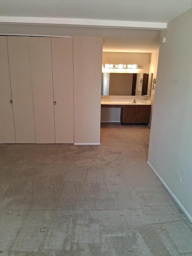 1702 Mill St Unit 502, Des Plaines, IL 60016 - unfurnished bedroom featuring carpet flooring, connected bathroom, and baseboards