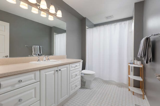 3211 Treyburn Rd, Naperville, IL 60564 - full bath with toilet, vanity, and tile patterned flooring