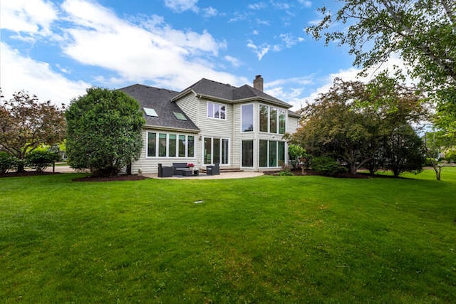 3211 Treyburn Rd, Naperville, IL 60564 - back of property featuring a chimney, a patio area, and a yard