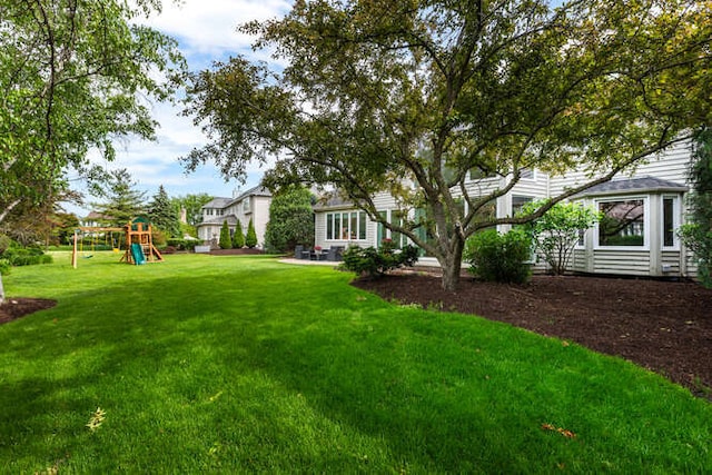 3211 Treyburn Rd, Naperville, IL 60564 - view of grassy yard featuring a playground